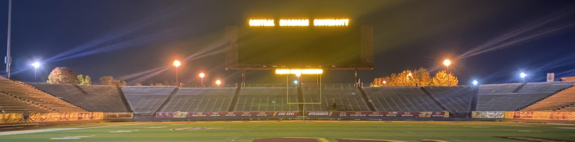 empty football stadium at night under the lights Charlotte